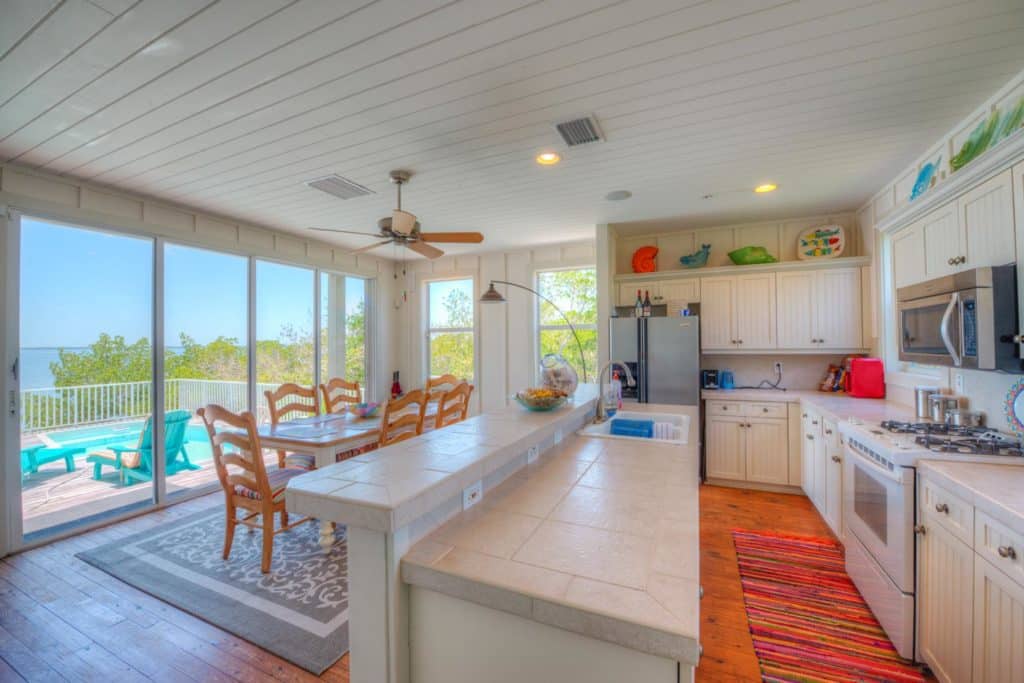 1 Crescent Island - Mansion Kitchen with View to Pool, Closer View