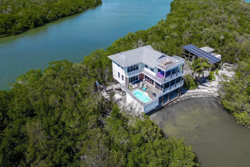 1 Crescent Island - Drone View of Exterior View of Beach Estate and Pool Deck, Closer View