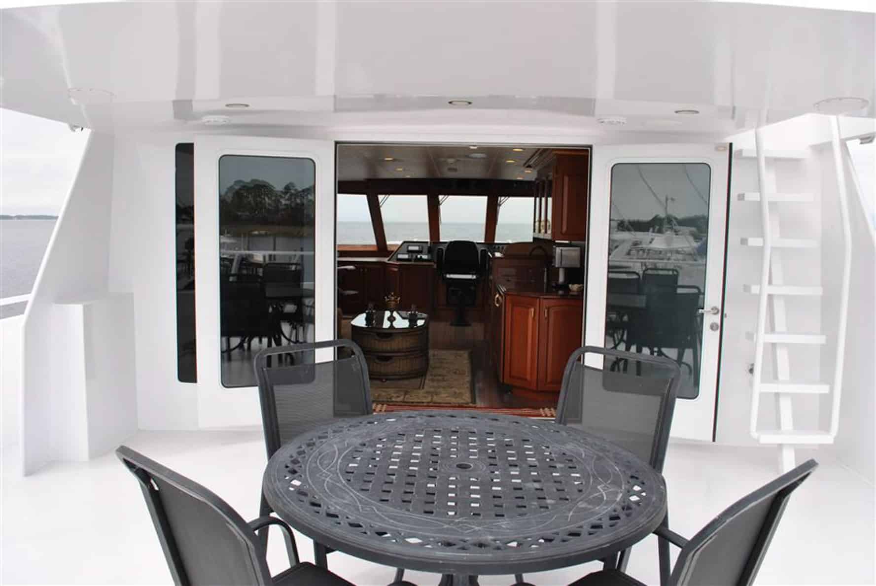 Jenny Lynne 87 Voyager - Luxury Yacht Exterior Dining Table with Cockpit Access